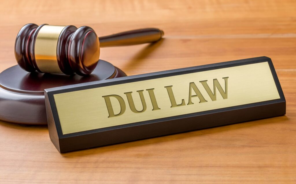 A hammer and a plate with the DUI law recorder