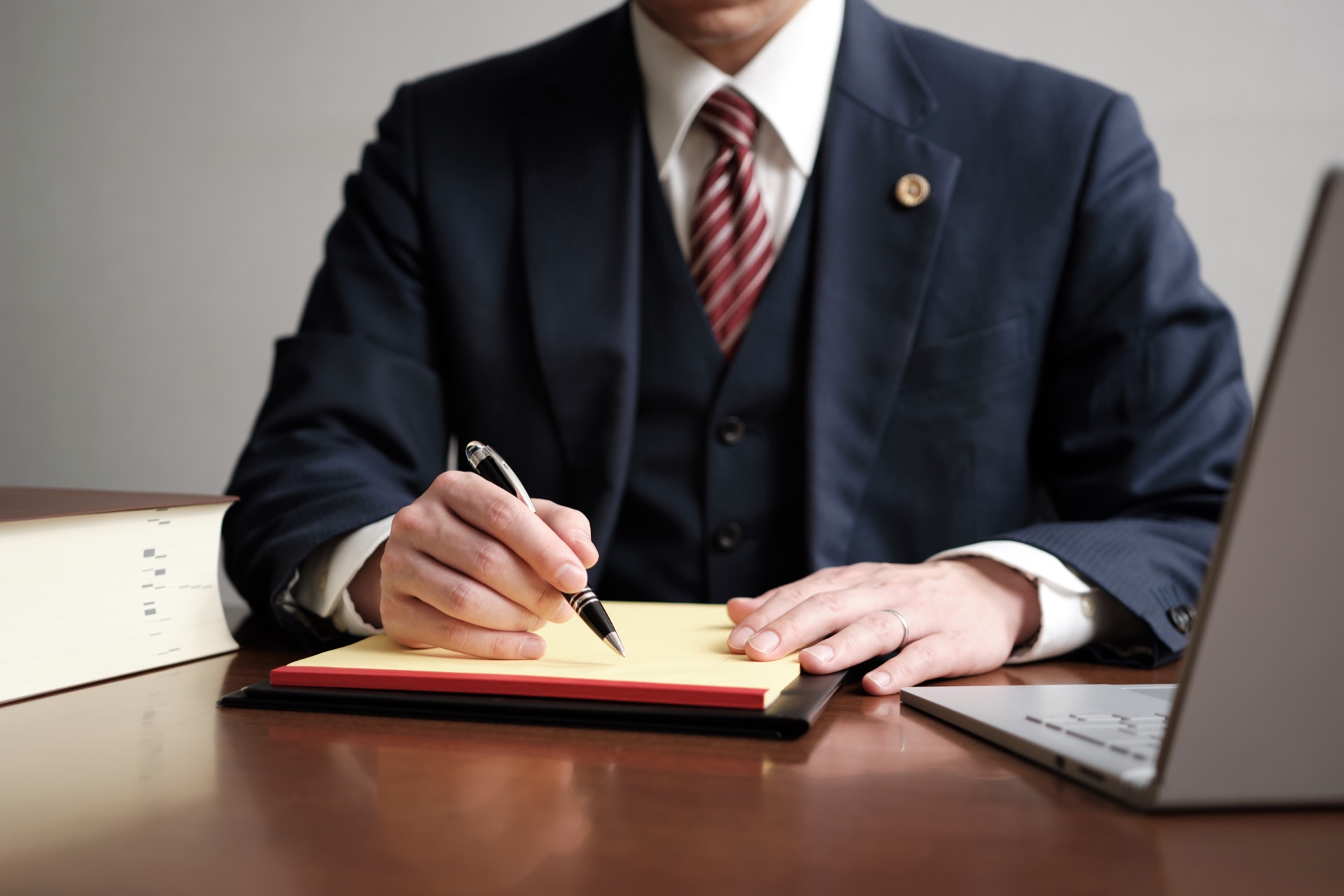 Criminal Defense Lawyer Signing Documents